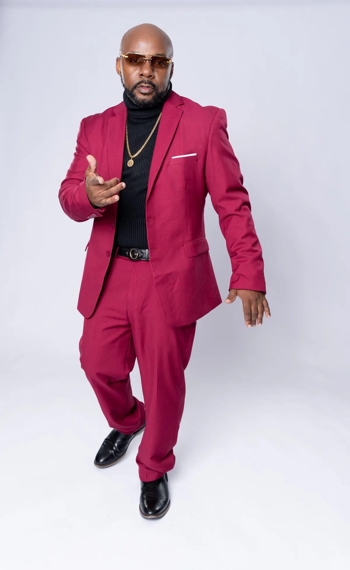 Surin in burgundy suit